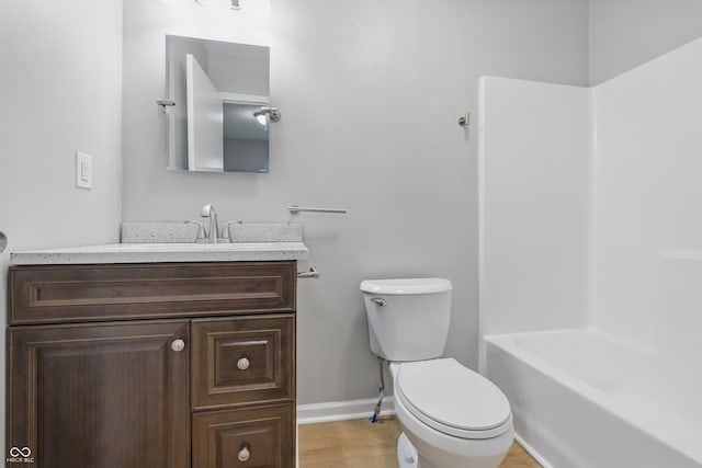 450 N Fenton Ave, Indianapolis, IN 46219 - bathroom featuring vanity,  shower combination, and wood finished floors