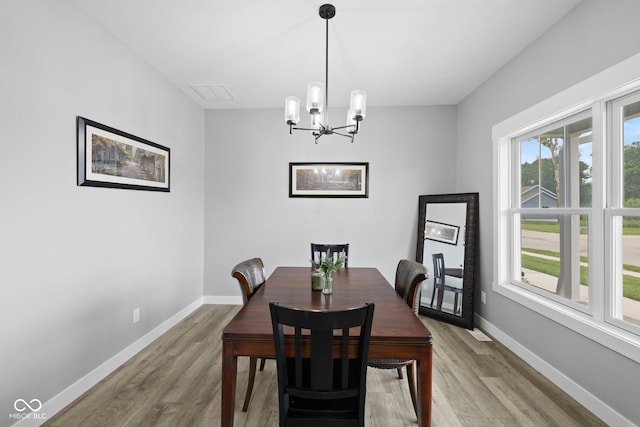 4545 Caroline Grace Ln, Terre Haute, IN 47802 - dining space featuring a chandelier and wood finished floors