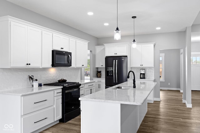 4545 Caroline Grace Ln, Terre Haute, IN 47802 - kitchen with black appliances, recessed lighting, decorative backsplash, pendant lighting, and white cabinets