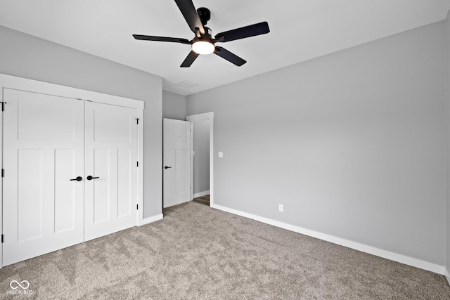4545 Caroline Grace Ln, Terre Haute, IN 47802 - unfurnished bedroom featuring carpet, a closet, and a ceiling fan