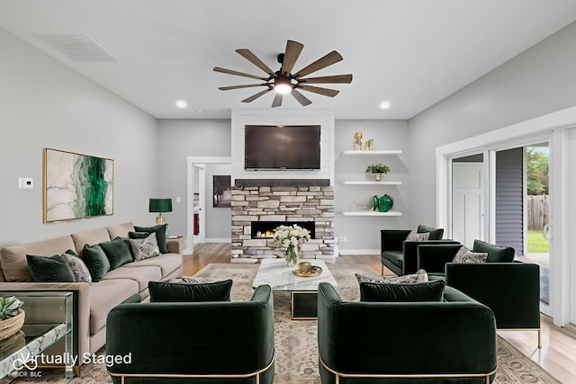 4545 Caroline Grace Ln, Terre Haute, IN 47802 - living area featuring a ceiling fan, a fireplace, wood finished floors, and recessed lighting