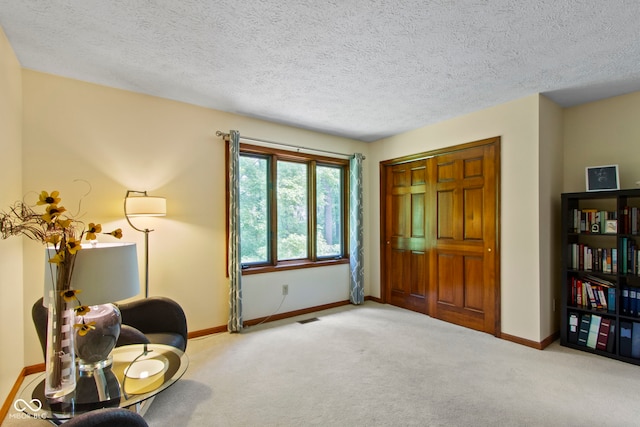 7426 Shadow Wood Dr, Indianapolis, IN 46254 - living area featuring carpet, baseboards, and a textured ceiling