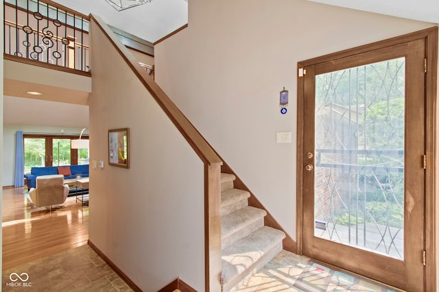 7426 Shadow Wood Dr, Indianapolis, IN 46254 - stairs featuring a high ceiling and baseboards