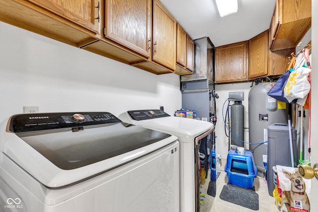 12121 E 21st St, Indianapolis, IN 46229 - laundry area featuring washer and clothes dryer and cabinet space