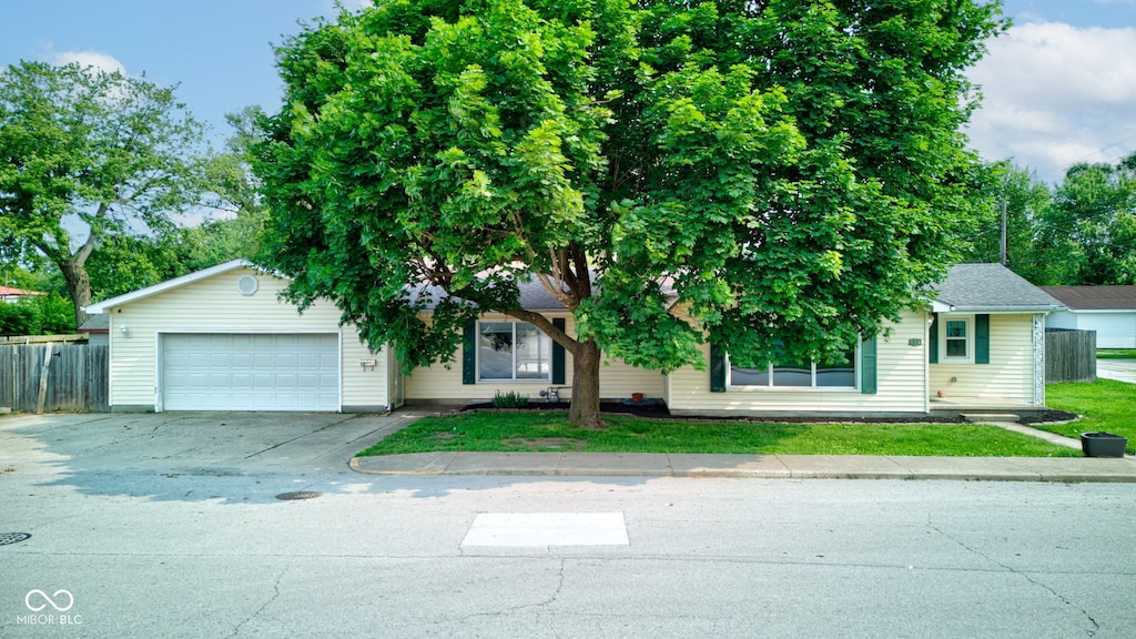 526 Dearborn St, Tipton, IN 46072 - view of front of property featuring driveway and a garage