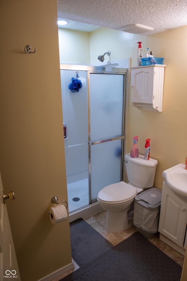 7402 Broadview Dr, Indianapolis, IN 46227 - full bath with toilet, a textured ceiling, vanity, a shower stall, and tile patterned floors