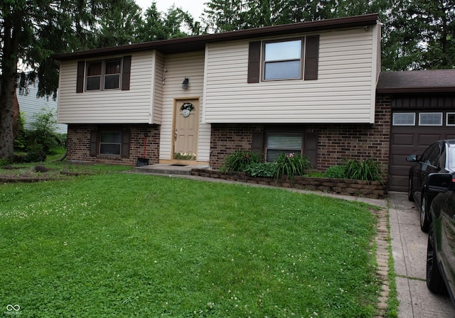 7402 Broadview Dr, Indianapolis, IN 46227 - split foyer home featuring brick siding, a front yard, and an attached garage
