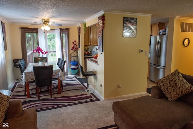 7402 Broadview Dr, Indianapolis, IN 46227 - dining room featuring a textured ceiling, a ceiling fan, ornamental molding, light carpet, and baseboards