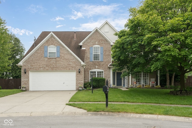 15409 Heath Cir, Westfield, IN 46074 - traditional home with driveway, a garage, and brick siding