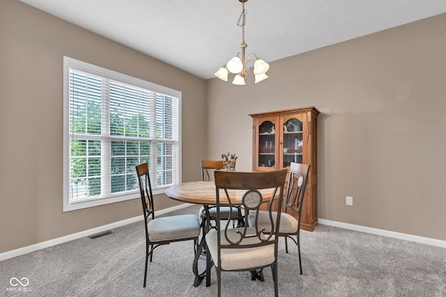 13766 Heatherfield Dr, Fishers, IN 46038 - dining area with a chandelier, light colored carpet, and baseboards