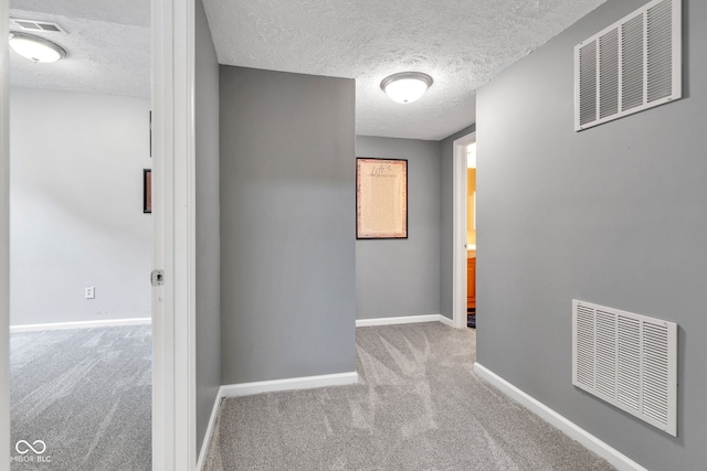 13766 Heatherfield Dr, Fishers, IN 46038 - hall featuring carpet floors, a textured ceiling, and baseboards