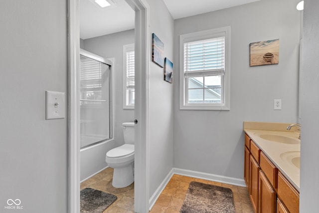 13766 Heatherfield Dr, Fishers, IN 46038 - full bath with baseboards, double vanity, toilet, and combined bath / shower with glass door