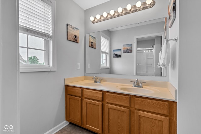 13766 Heatherfield Dr, Fishers, IN 46038 - bathroom with double vanity, a shower, and baseboards