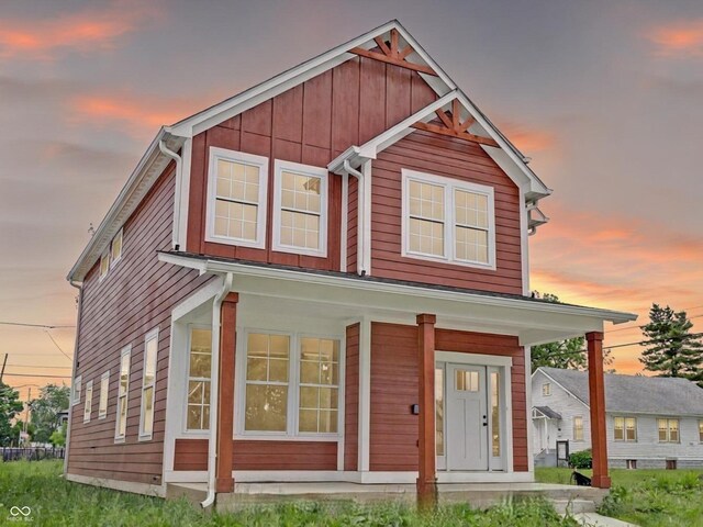 2903 Winthrop Ave, Indianapolis, IN 46205 - view of front of house featuring covered porch and board and batten siding