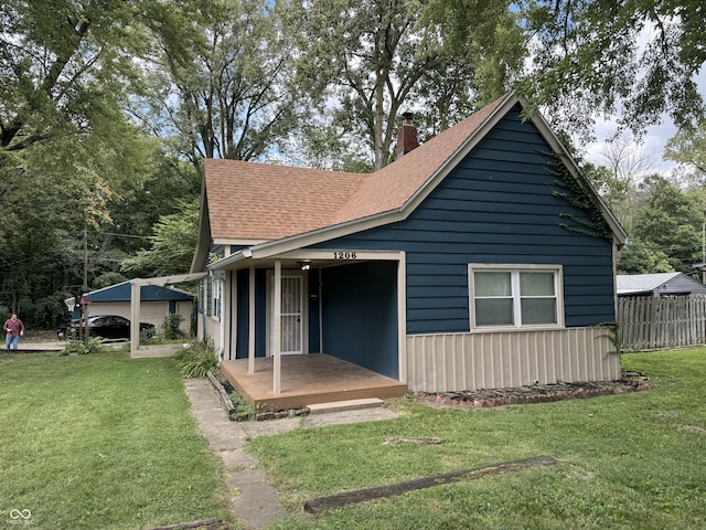 1206 Mcdougal St, Indianapolis, IN 46203 - view of front of home featuring a chimney and roof with shingles