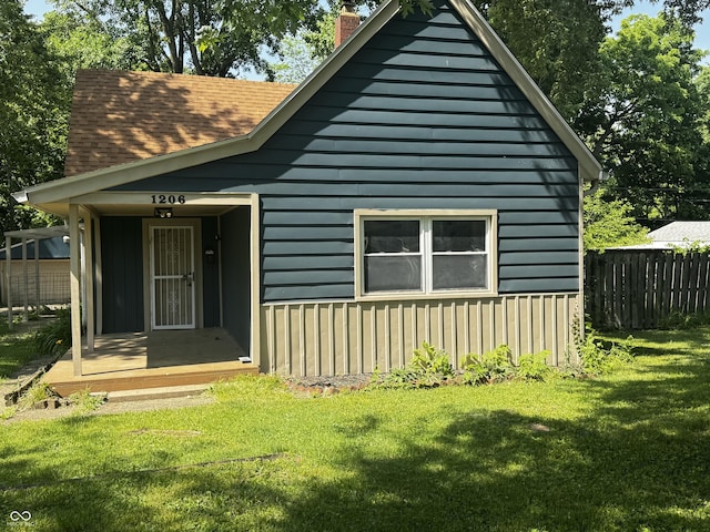 1206 Mcdougal St, Indianapolis, IN 46203 - view of front of home with a chimney and a shingled roof