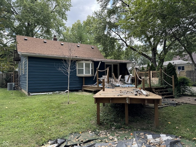 1206 Mcdougal St, Indianapolis, IN 46203 - rear view of property with a wooden deck, a yard, central AC, and a chimney