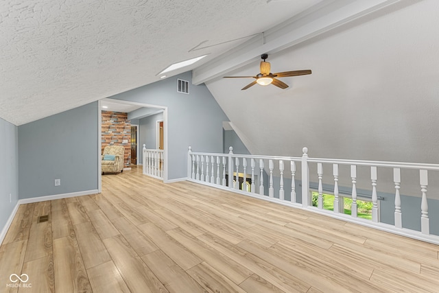 7630 Blain Way, Indianapolis, IN 46254 - bonus room featuring a ceiling fan, wood finished floors, baseboards, and a textured ceiling