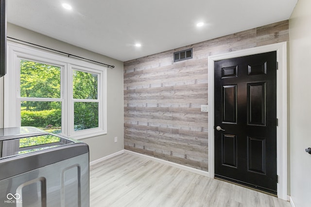7630 Blain Way, Indianapolis, IN 46254 - foyer entrance with wood walls, washer / dryer, baseboards, wood finished floors, and recessed lighting