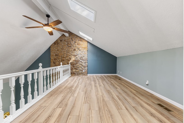 7630 Blain Way, Indianapolis, IN 46254 - additional living space with ceiling fan, wood finished floors, baseboards, and a skylight