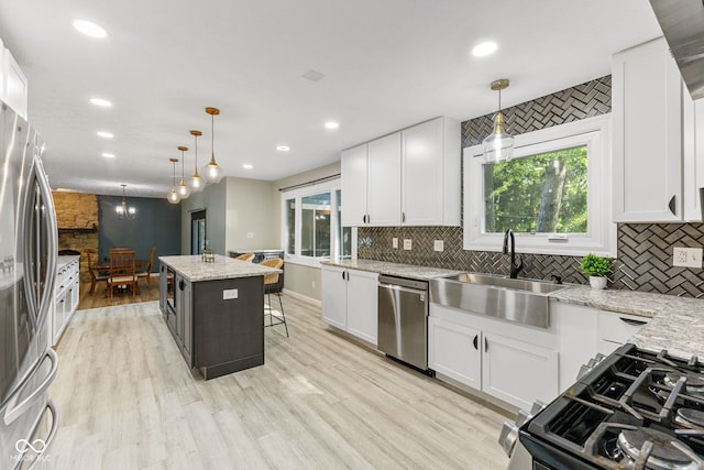 7630 Blain Way, Indianapolis, IN 46254 - kitchen featuring appliances with stainless steel finishes, a sink, tasteful backsplash, plenty of natural light, and recessed lighting