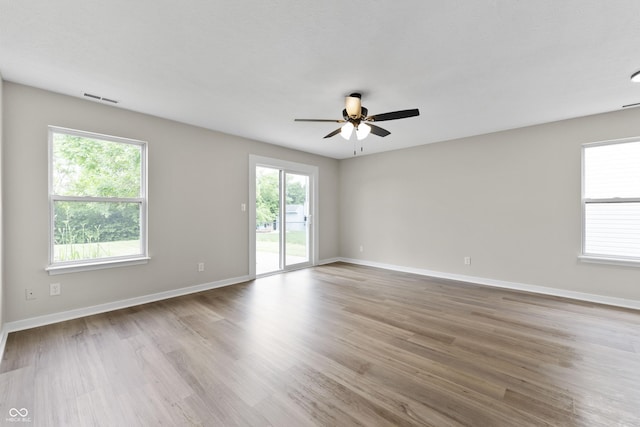 1313 Kenwood Dr, Greenwood, IN 46143 - empty room featuring a ceiling fan, wood finished floors, and baseboards
