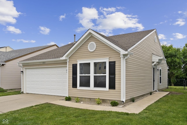 1313 Kenwood Dr, Greenwood, IN 46143 - view of front of home featuring driveway, an attached garage, and a shingled roof