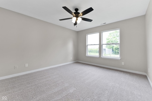 1313 Kenwood Dr, Greenwood, IN 46143 - carpeted spare room featuring baseboards and ceiling fan