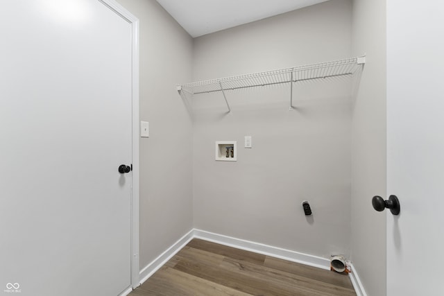 1313 Kenwood Dr, Greenwood, IN 46143 - washroom with dark wood-type flooring, baseboards, and hookup for a washing machine