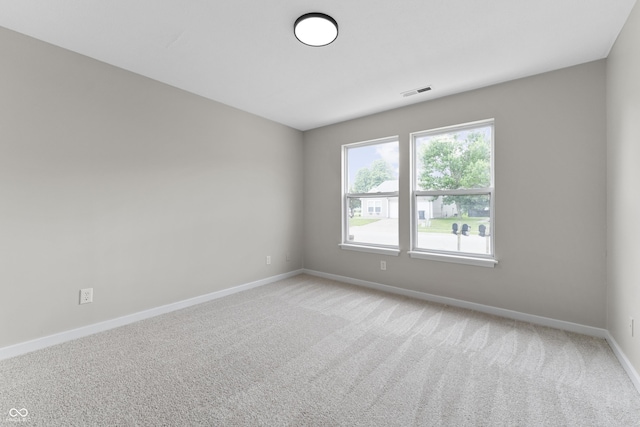 1313 Kenwood Dr, Greenwood, IN 46143 - empty room featuring baseboards and light colored carpet