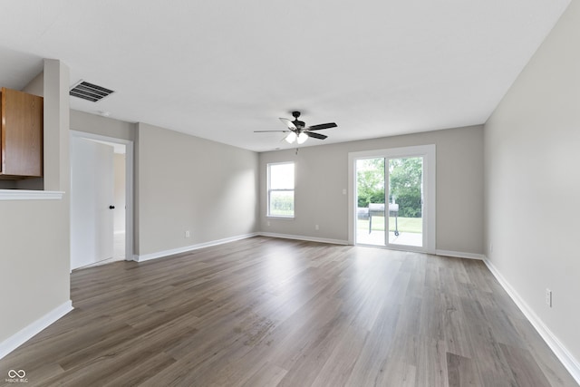 1313 Kenwood Dr, Greenwood, IN 46143 - empty room with wood finished floors, ceiling fan, and baseboards