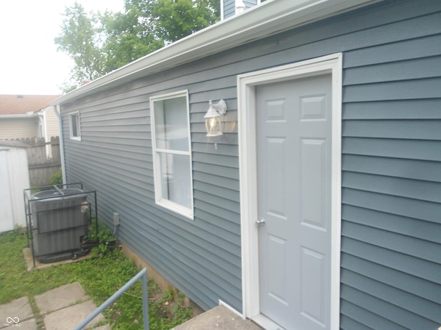 property entrance with central AC unit