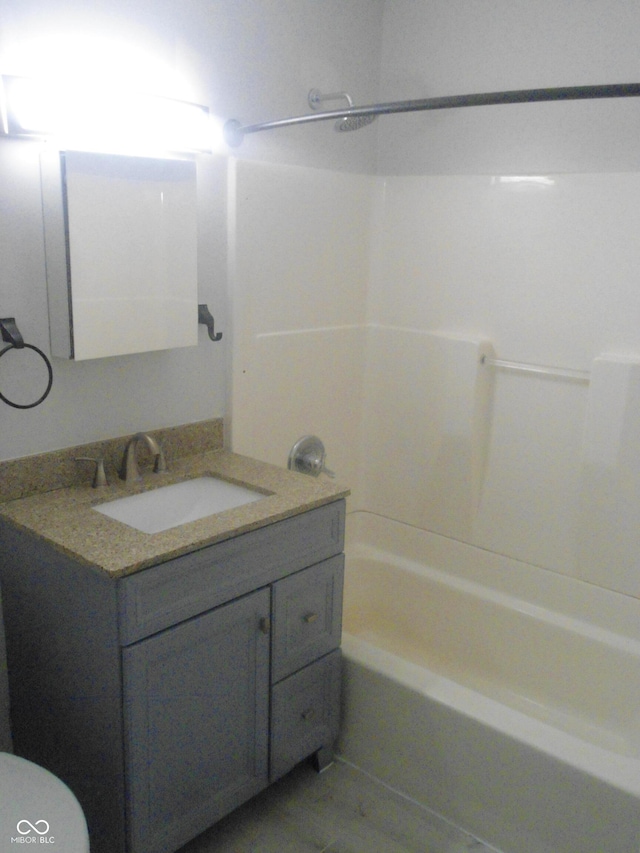 full bathroom with shower / tub combination, vanity, and toilet
