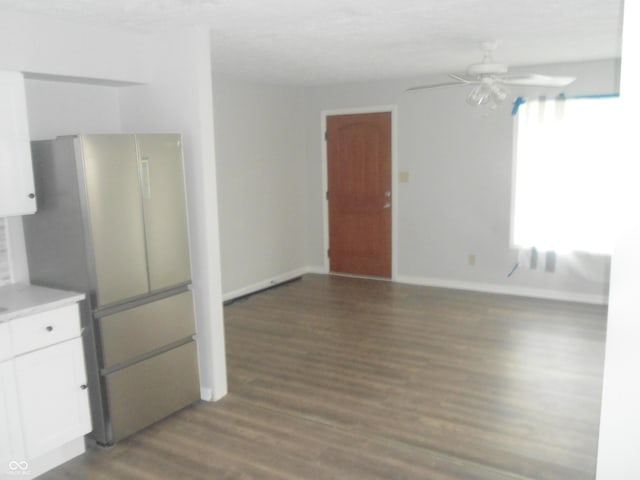 kitchen featuring a ceiling fan, white cabinetry, wood finished floors, light countertops, and freestanding refrigerator