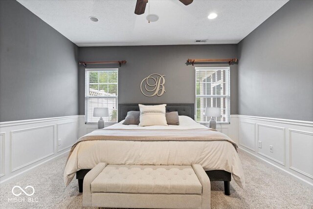 1905 Persimmon Grove Dr, Indianapolis, IN 46234 - carpeted bedroom featuring a wainscoted wall, a decorative wall, ceiling fan, and recessed lighting