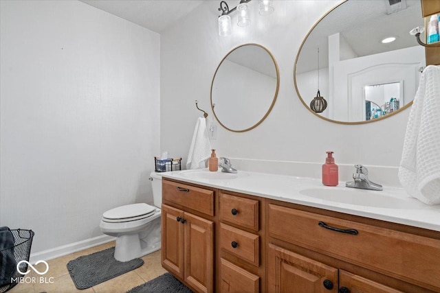 1905 Persimmon Grove Dr, Indianapolis, IN 46234 - bathroom featuring double vanity, tile patterned flooring, baseboards, and toilet