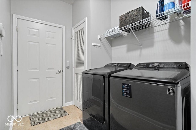 1905 Persimmon Grove Dr, Indianapolis, IN 46234 - washroom featuring washer and dryer, light tile patterned floors, and baseboards