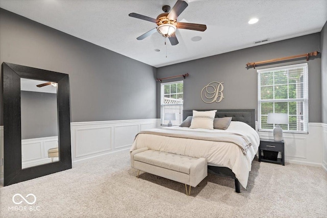 1905 Persimmon Grove Dr, Indianapolis, IN 46234 - carpeted bedroom featuring a wainscoted wall, a decorative wall, and ceiling fan