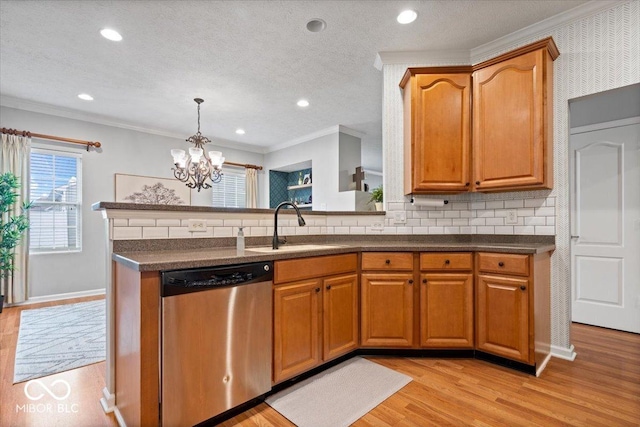 1905 Persimmon Grove Dr, Indianapolis, IN 46234 - kitchen featuring stainless steel dishwasher, a sink, dark countertops, a chandelier, and backsplash