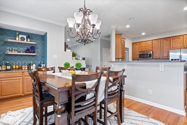 1905 Persimmon Grove Dr, Indianapolis, IN 46234 - dining room featuring ornamental molding, a chandelier, light wood-style floors, recessed lighting, and bar area