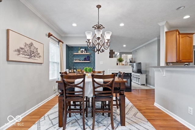 1905 Persimmon Grove Dr, Indianapolis, IN 46234 - dining space with crown molding, light wood-style floors, recessed lighting, a chandelier, and baseboards