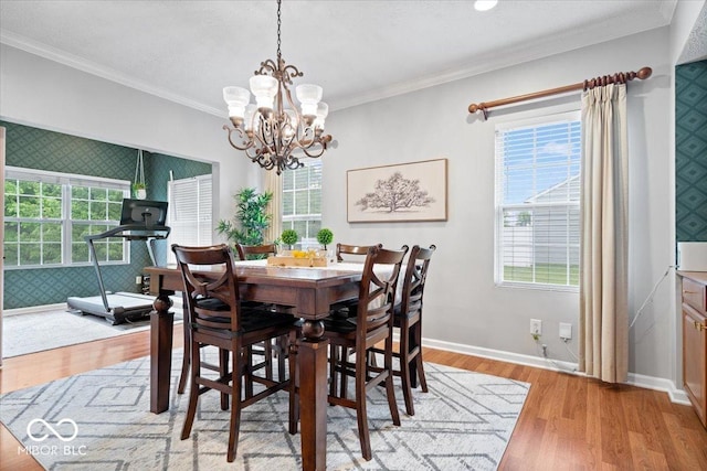 1905 Persimmon Grove Dr, Indianapolis, IN 46234 - dining space featuring a chandelier, healthy amount of natural light, light wood finished floors, crown molding, and baseboards