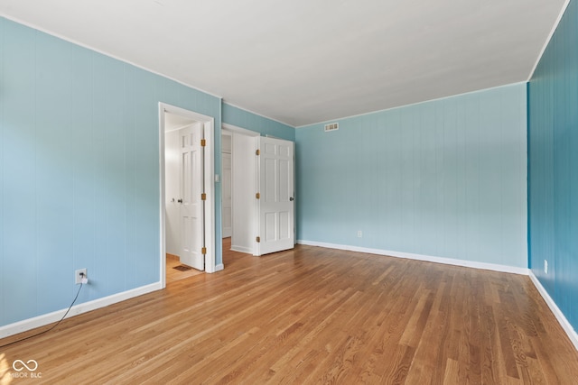 308 Hickory Hill Dr, Terre Haute, IN 47802 - empty room featuring wood finished floors, baseboards, and crown molding