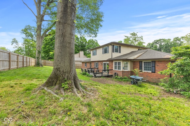 308 Hickory Hill Dr, Terre Haute, IN 47802 - back of property with brick siding and roof with shingles