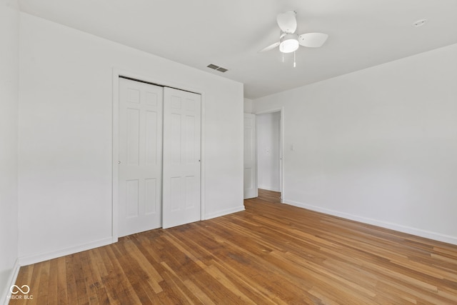 308 Hickory Hill Dr, Terre Haute, IN 47802 - unfurnished bedroom with wood finished floors, baseboards, and a closet