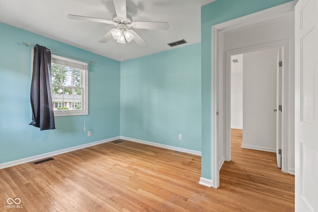 308 Hickory Hill Dr, Terre Haute, IN 47802 - spare room featuring baseboards, light wood finished floors, and ceiling fan