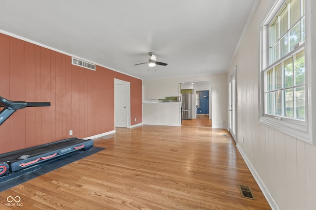 308 Hickory Hill Dr, Terre Haute, IN 47802 - exercise room with light wood-style flooring, ceiling fan, healthy amount of natural light, ornamental molding, and baseboards