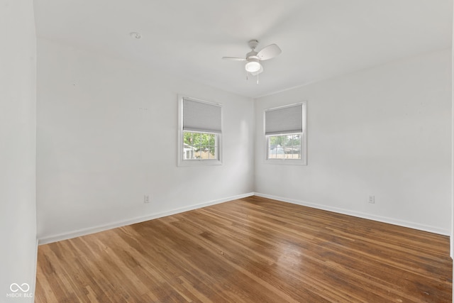 308 Hickory Hill Dr, Terre Haute, IN 47802 - empty room with wood finished floors, a ceiling fan, and baseboards