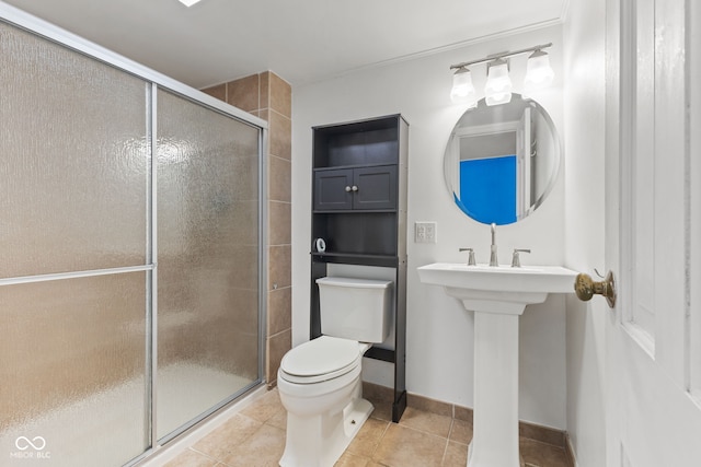 308 Hickory Hill Dr, Terre Haute, IN 47802 - bathroom with toilet, a shower stall, tile patterned floors, and baseboards