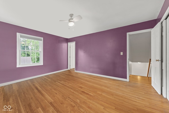 308 Hickory Hill Dr, Terre Haute, IN 47802 - spare room featuring light wood-type flooring, baseboards, and a ceiling fan